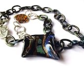 Asymmetrical Glass Pendant Statement Necklace with Leaf Toggle - Iridescent Blue, Green, Metallic, and Black - 20"