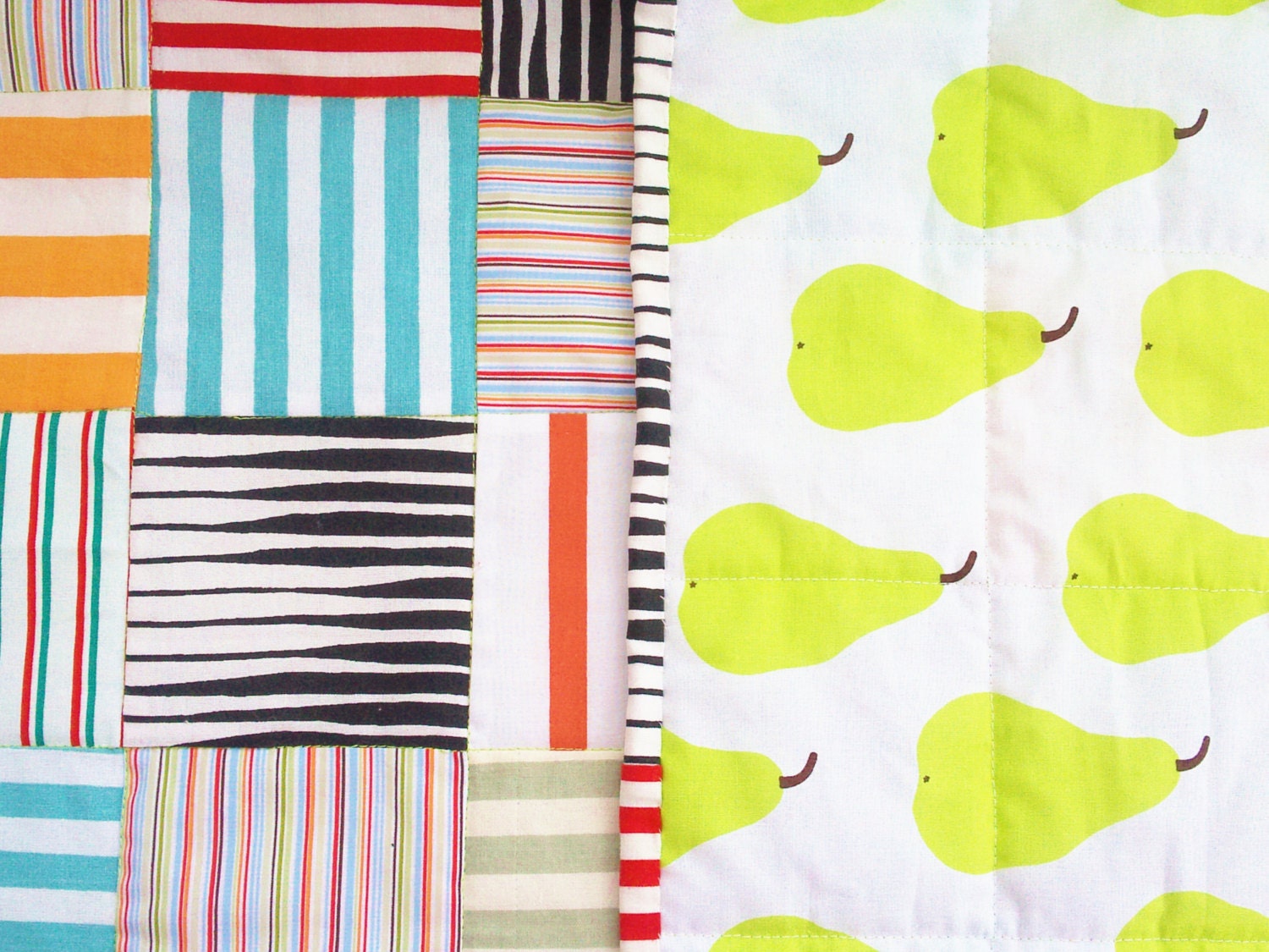Sporty quilt for kids with striped colorful cottons and pears by Marimekko