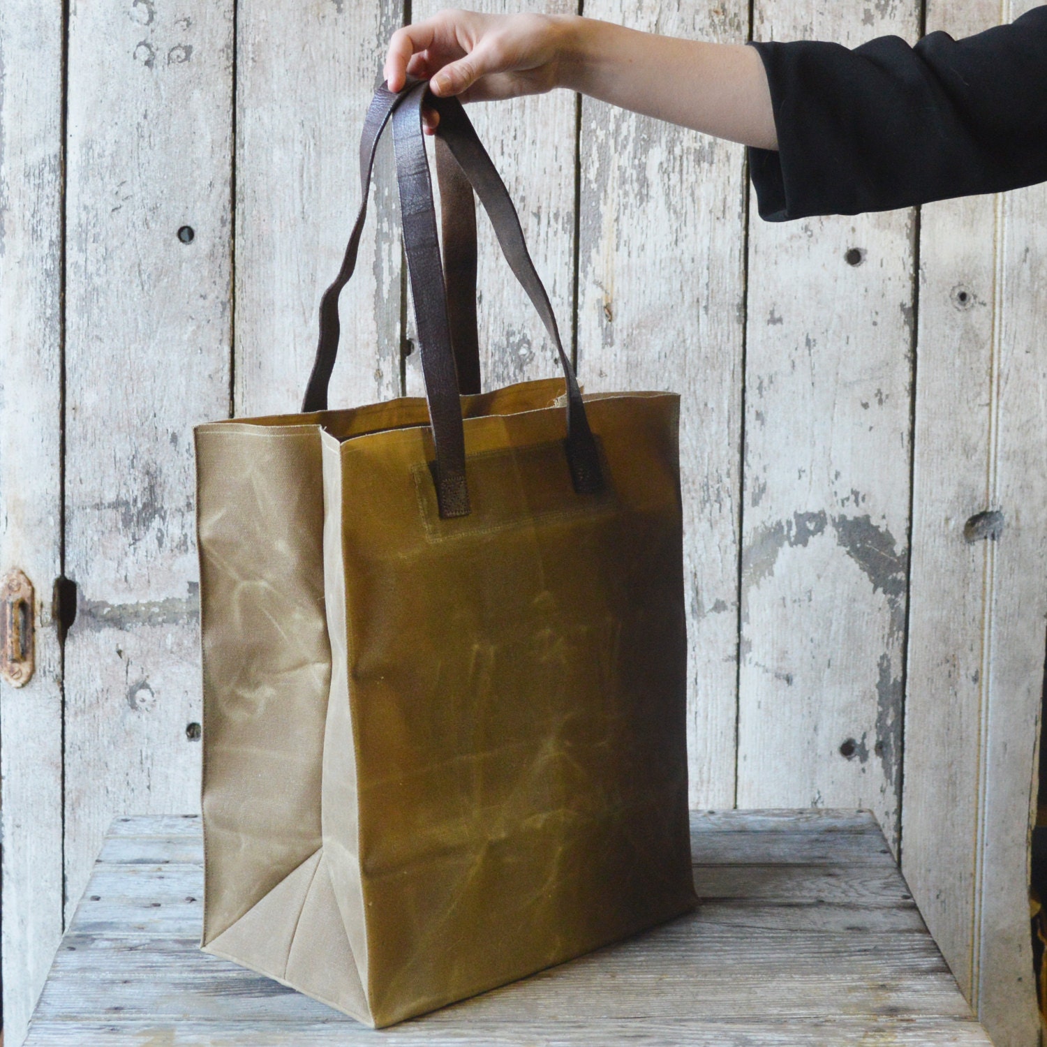 The Marlowe Carryall, waxed canvas and antique leather.