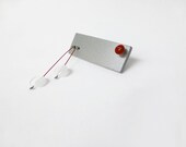 geometric tribal bracelet/cuff with grey and white sticks and pink beads