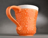 Curvy Dottie Coffee Mug Ready To Ship Orange And White Stoneware Dottie Mug by Symmetrical Pottery