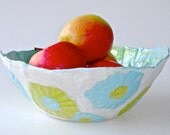 Ceramic serving bowl with turquoise and chartreuse flowers