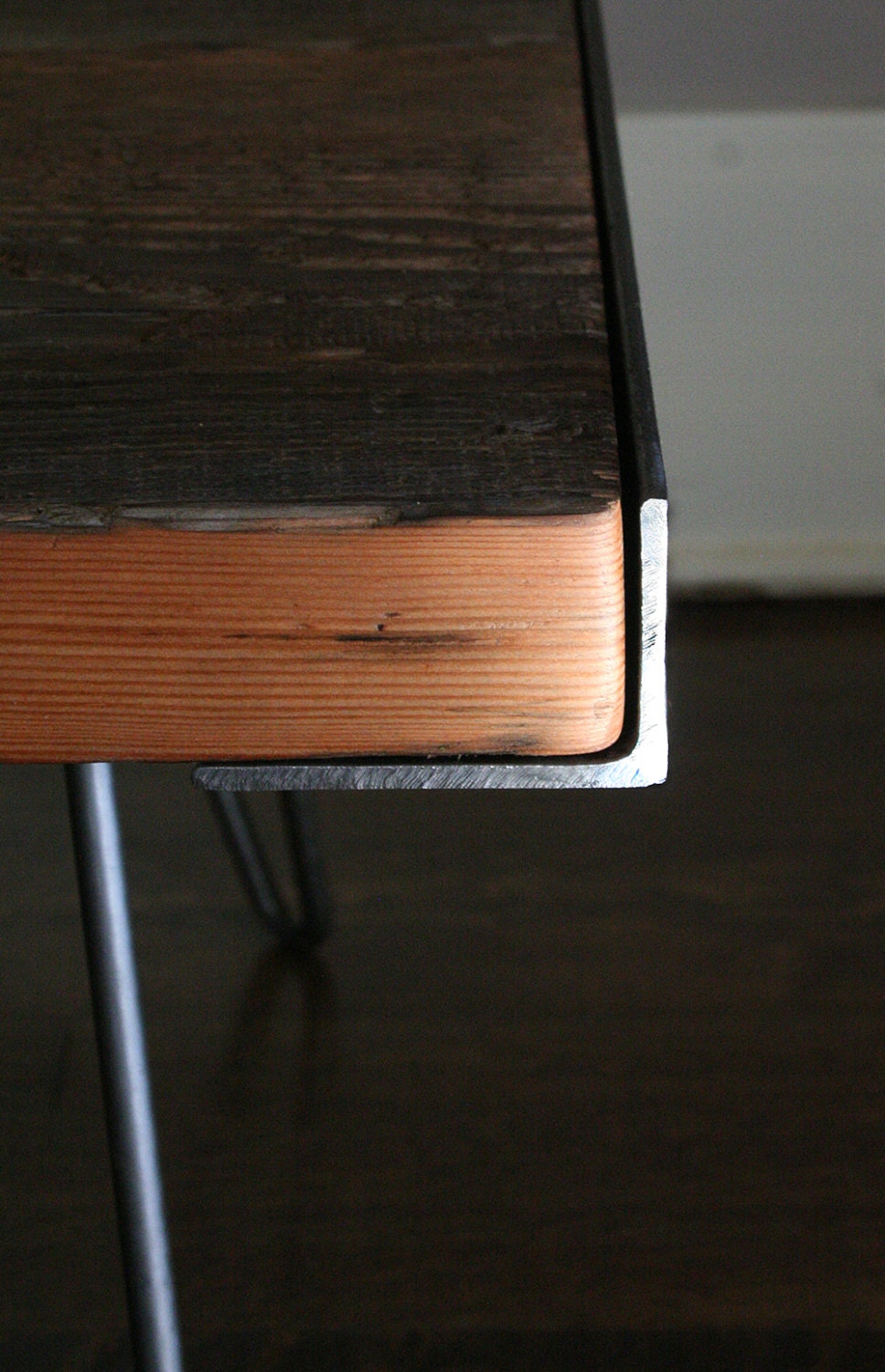 between table, from reclaimed old growth wood and recycled steel