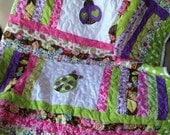 Lime green, pink, brown, and purple baby girl ladybug quilt