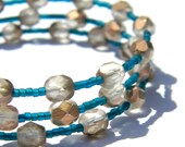 Apollo Gold & Teal Bracelet  Metallic Golden Czech Glass Beads and Matte Peacock Seed Beads  Memory Wire Beaded Jewelry  Statement Bangle