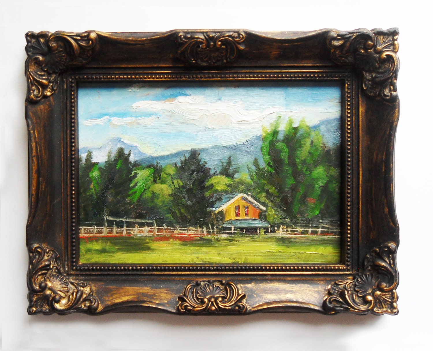 Farm House and white Picket Fence in Idaho. 5x7" Landscape done on masonite. Green, red, white, blue sky, mountain.