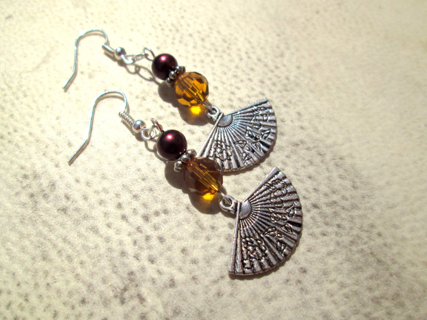 Cho. Dangle Earrings with Silver Fan Charms with Honey Czech Glass Beads and Rose Pearls.