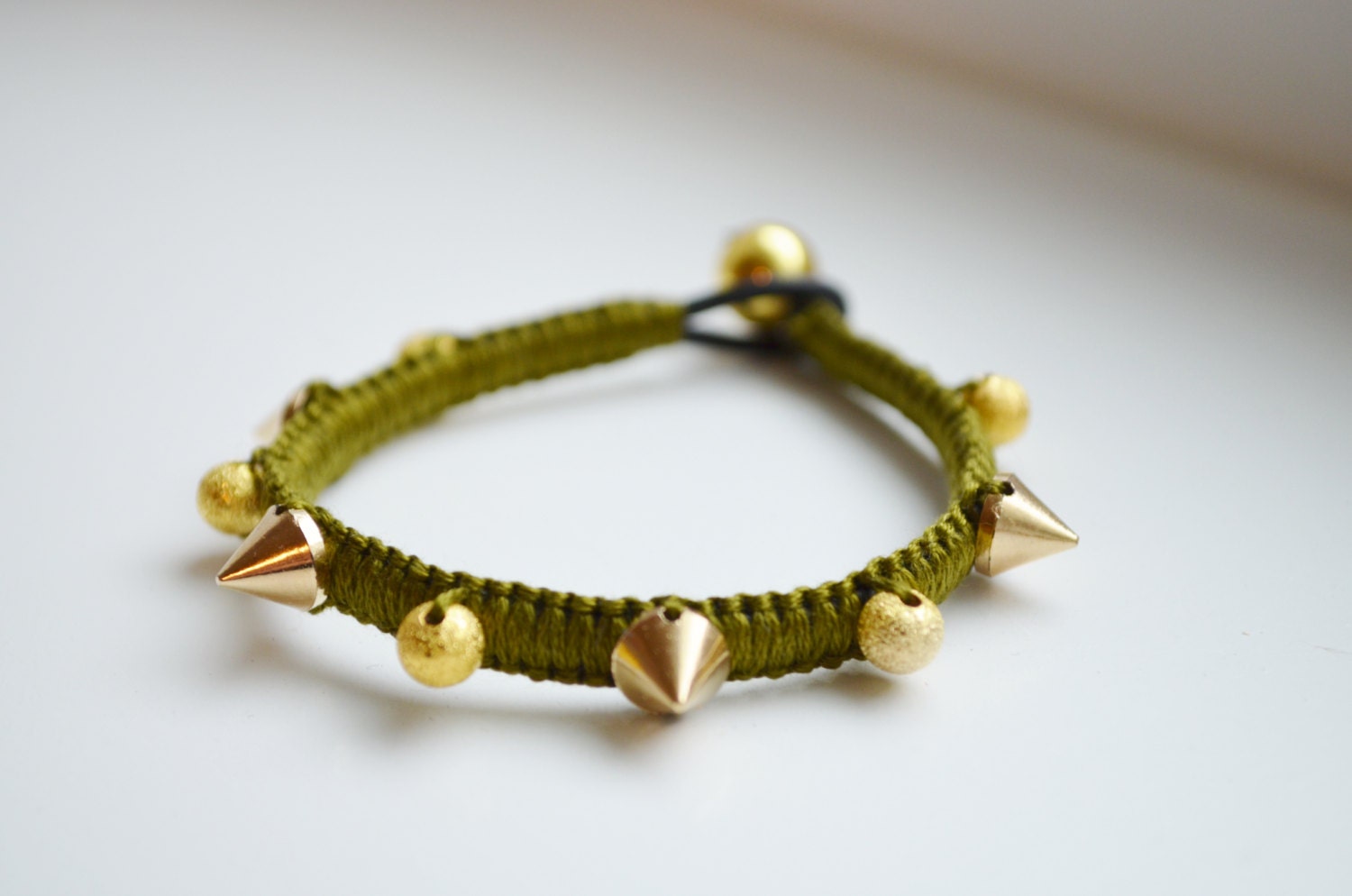 Olive green and gold spike bracelet