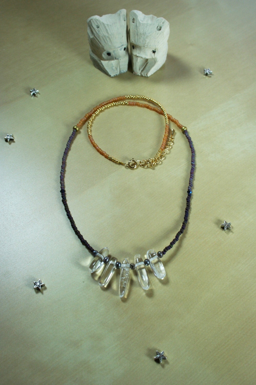 Crystal quartz necklace with purple and gold seed beads
