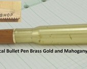 50 cal Bullet Pen brass, gold and Mahogany.