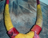 Handcrafted necklace made of felted merinowool combined with beads from Africa