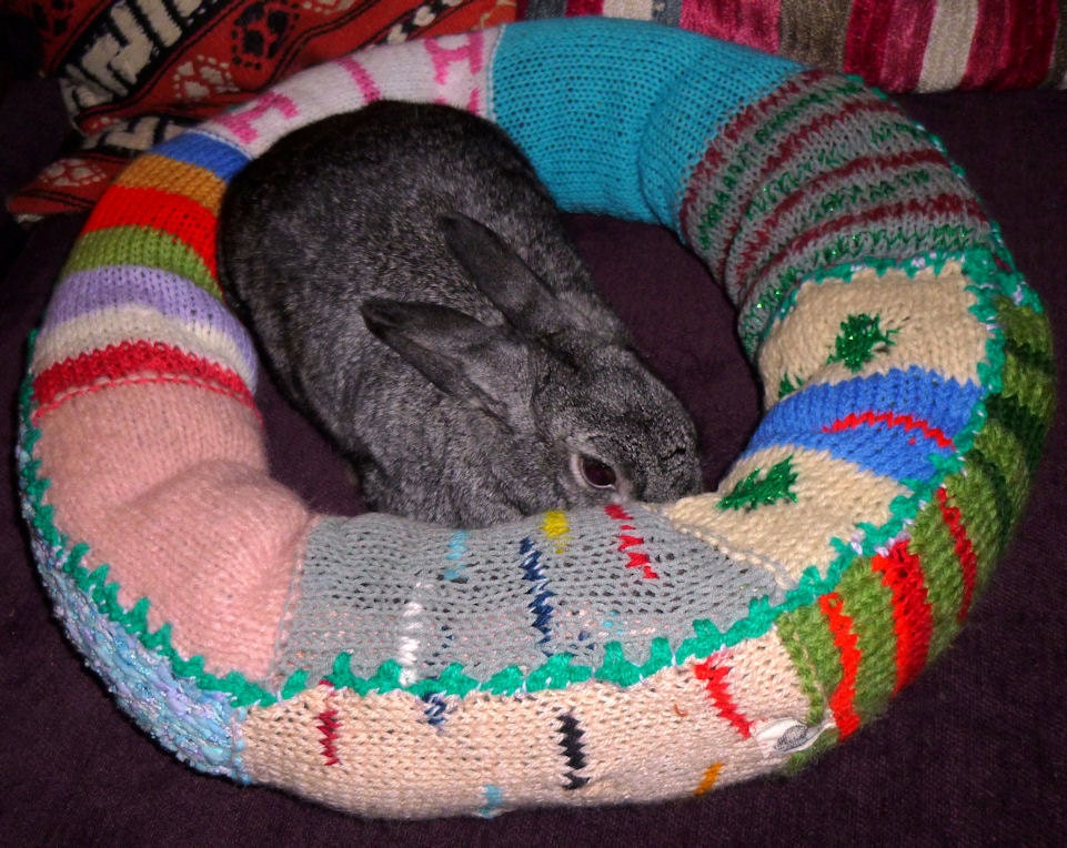 Ugli Donut bunny rabbit bed for a medium to large sized bunny hand knit pink and turquoise