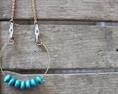 SALE: Teal wooden beads on brass moon wire Necklace