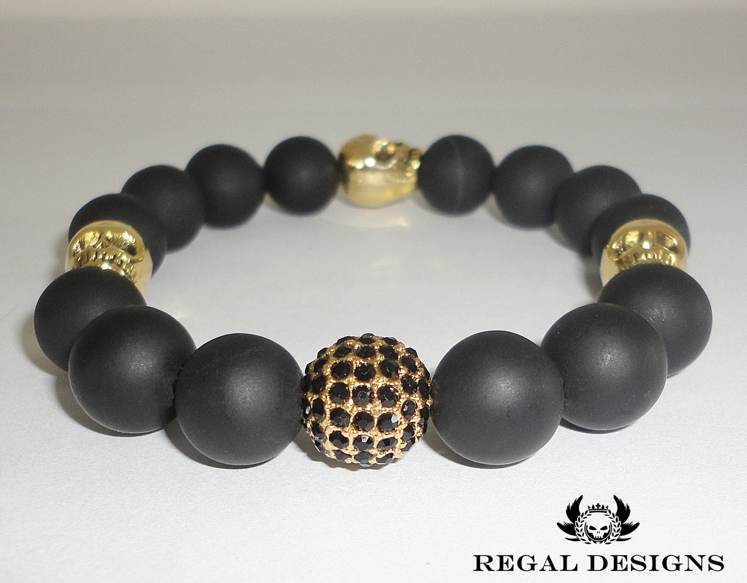 MASCULINE - Black Onyx Bracelet With Gold Skull And Black Crystal Pave' Accents - Jewelry For Men