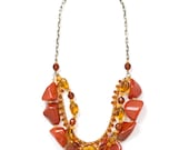 Multi layer statement necklace with semi-precious stones and glass beads.