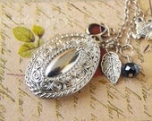 Silver tea - an oval silver locket necklace