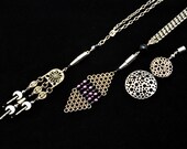 RESERVED- Imagination is your limit necklace made with black and purple czech crystals and silver toned brass filigrees