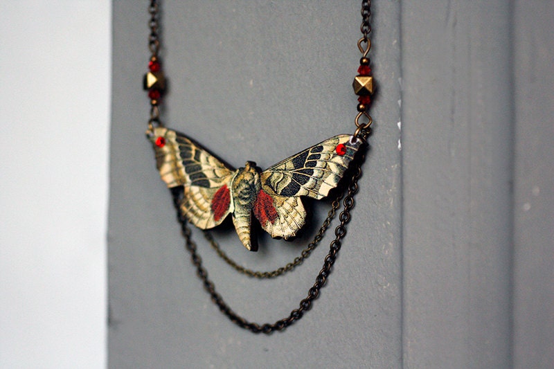 Woodcut moth necklace
