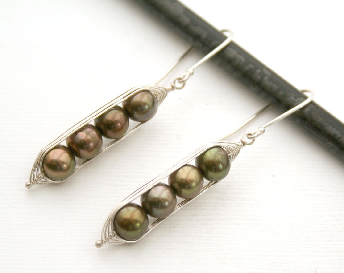 Peapod earrings. Four peas in a pod with metallic forest green fresh water pearls.