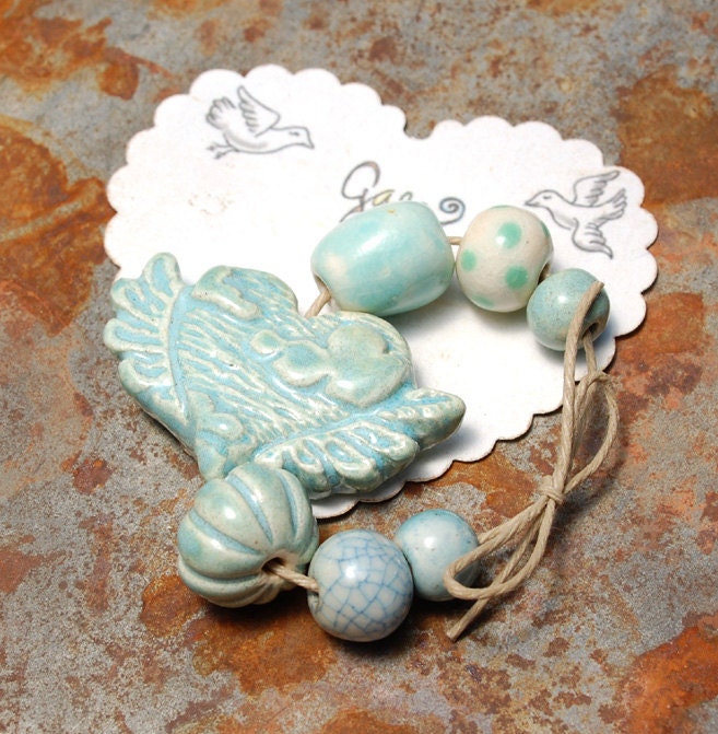 RESERVED for the lovely WrappedInLeather / Wild Blue / Sky Tone Ceramic WInged Sky Heart Bead Set