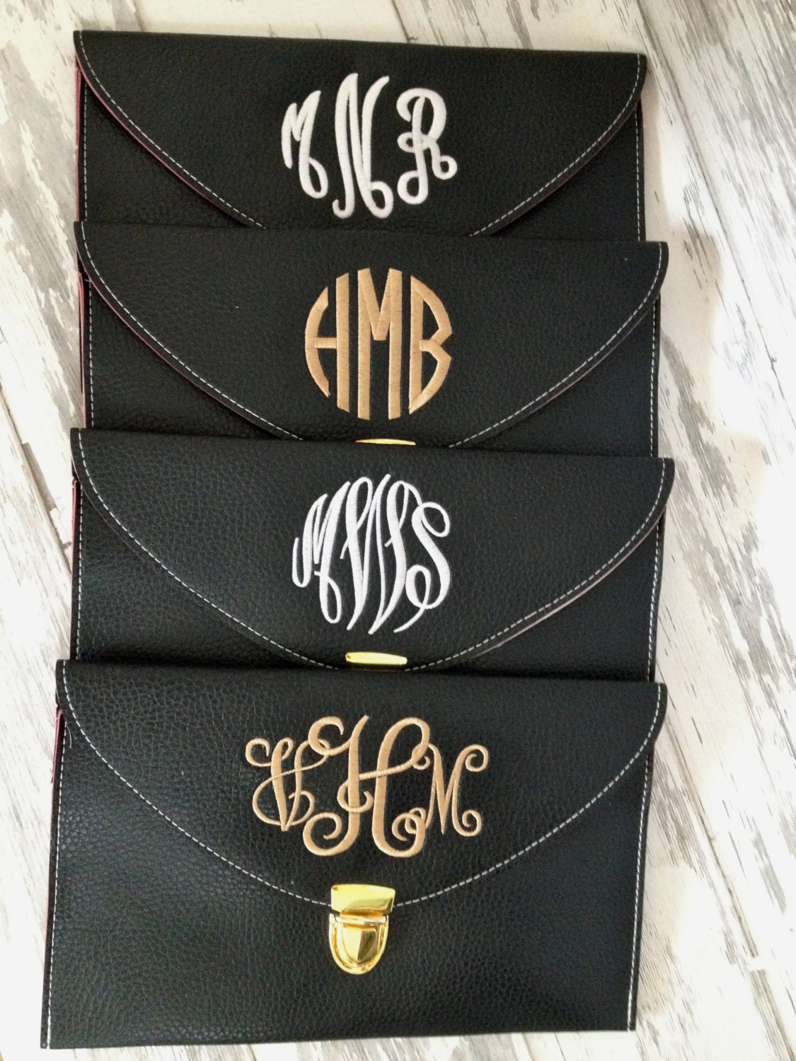 monogrammed envelope clutch in BLACK