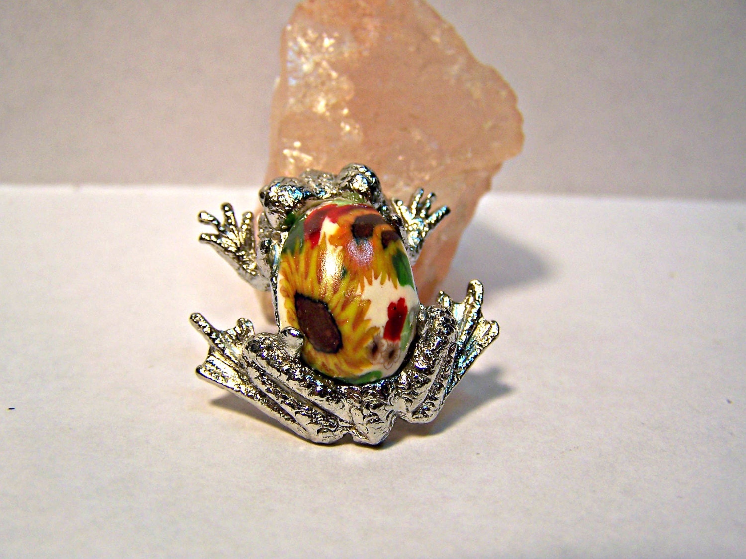Frisky sliver frog brooch featuring sunflower polymer clay cabochon