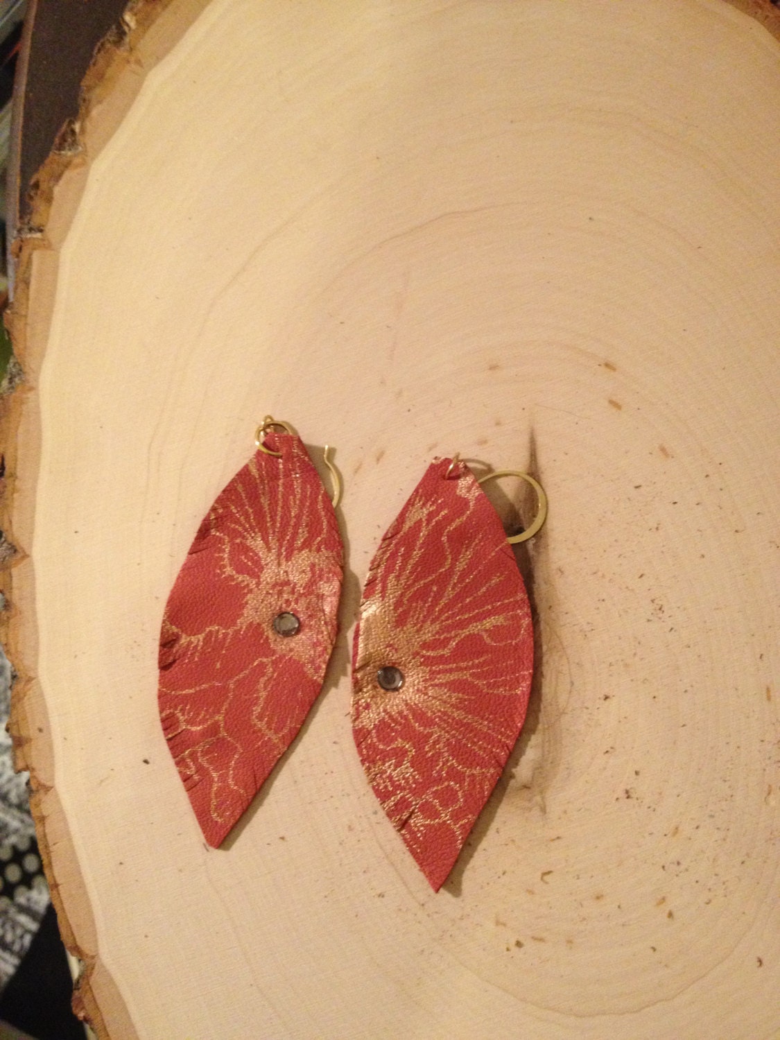 Leather Featherlight floral coral earrings.