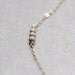 stellar in gold - tiny bead necklace by elephantine