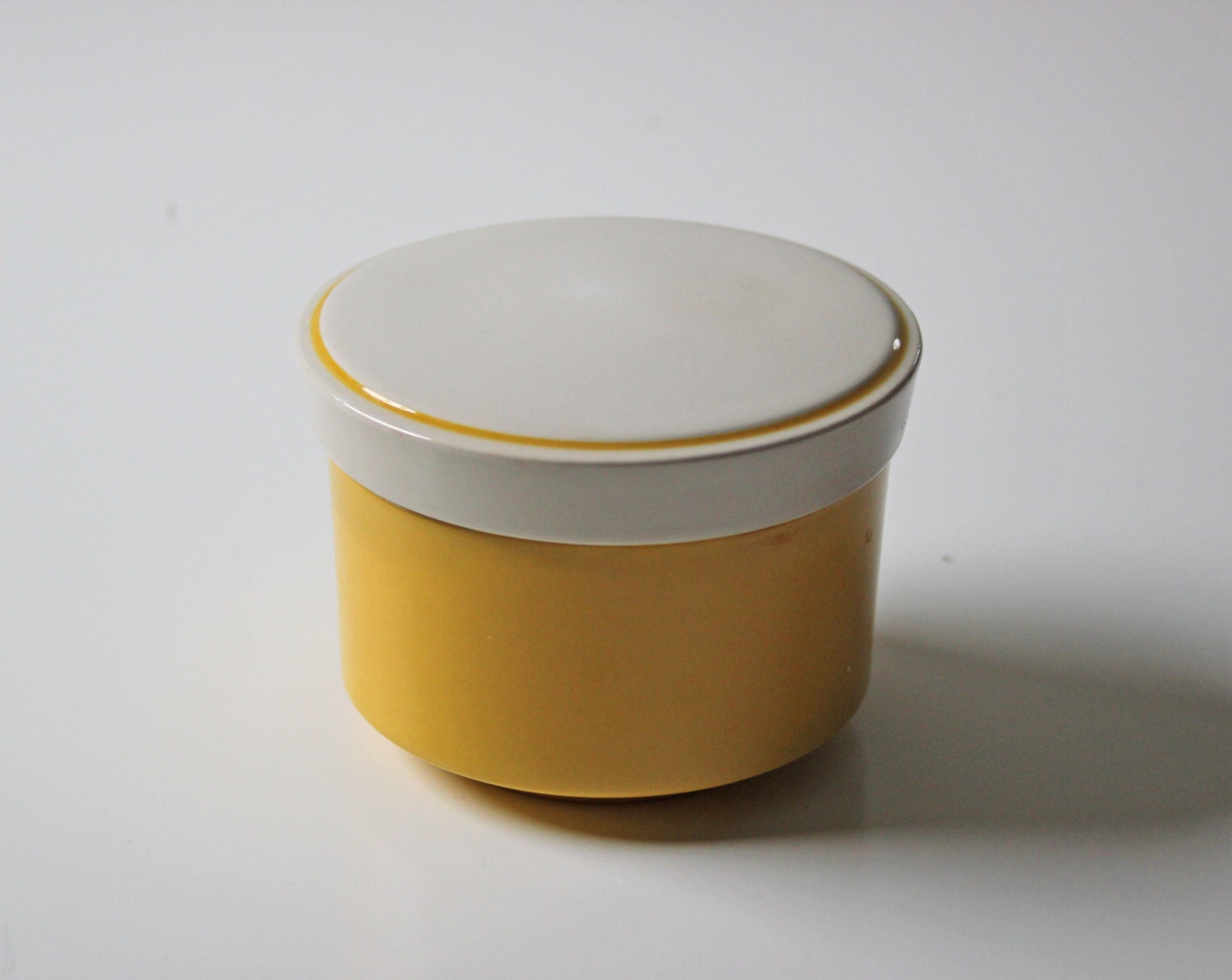 yellow ceramic sugar or salt container