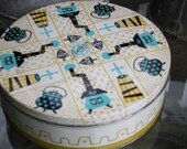vintage tin fill with  cookies, buttons, jewelry Barricini   10 inches by 3 inches