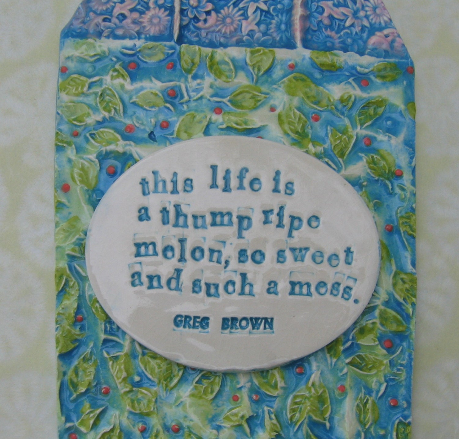 Greg Brown Life is thump ripe melon ceramic wall hanging