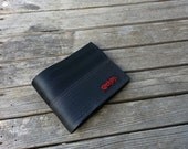 Seat belt wallet made from reclaimed seat belt straps and used bike inner tube