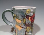 Cup with layered green glaze,  poppies, and gold decals