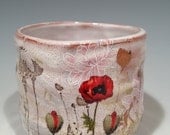 Cup with  pink flowers and poppies