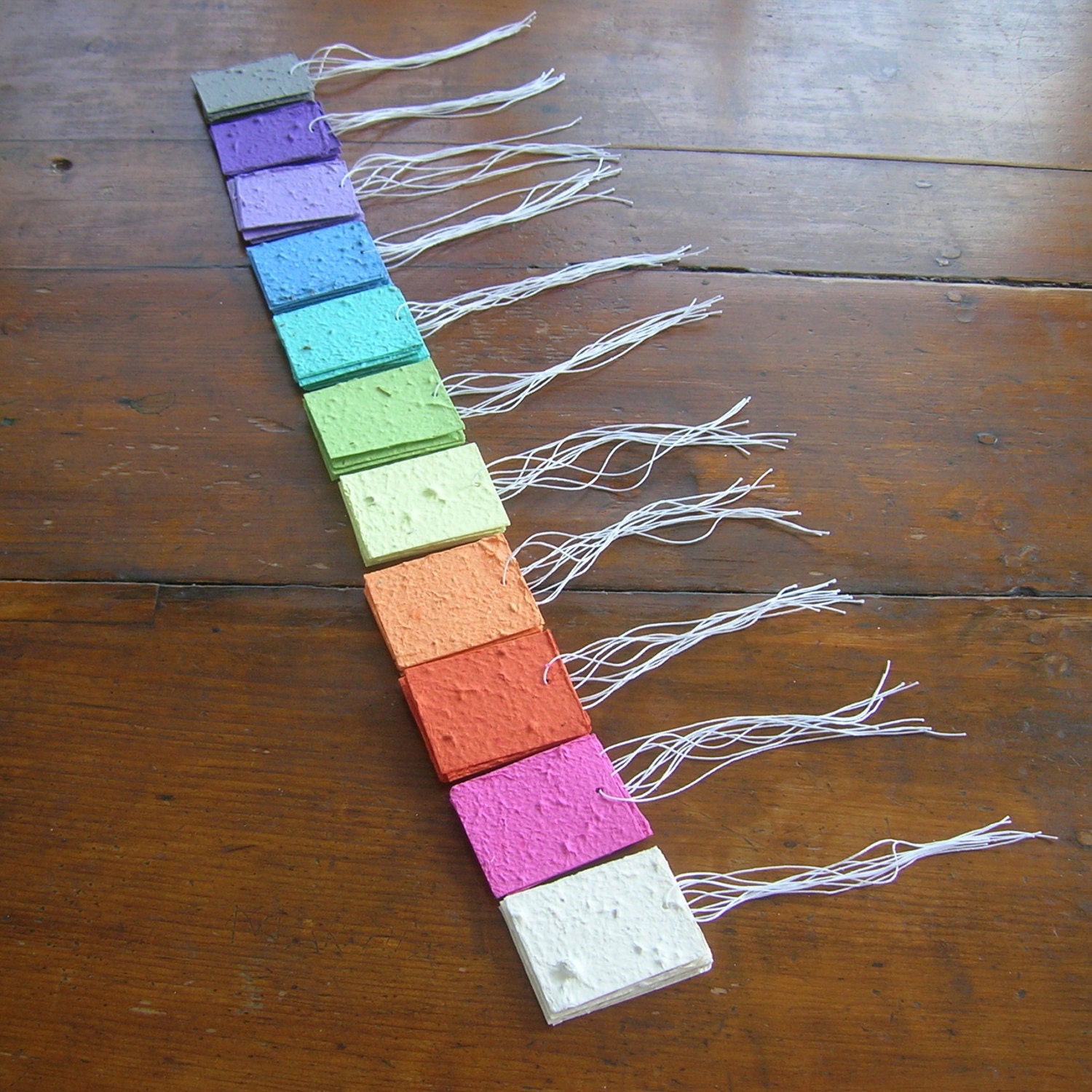 Plantable paper tags in a rainbow assortment for your garden celebration - Wedding place card - Made of handmade paper and wildflower seeds