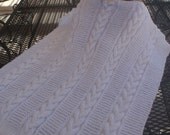 Knitted white cable baby blanket for a boy or girl