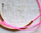 neon light pink super skinny nylon triple wrap bracelet with two long gold tube