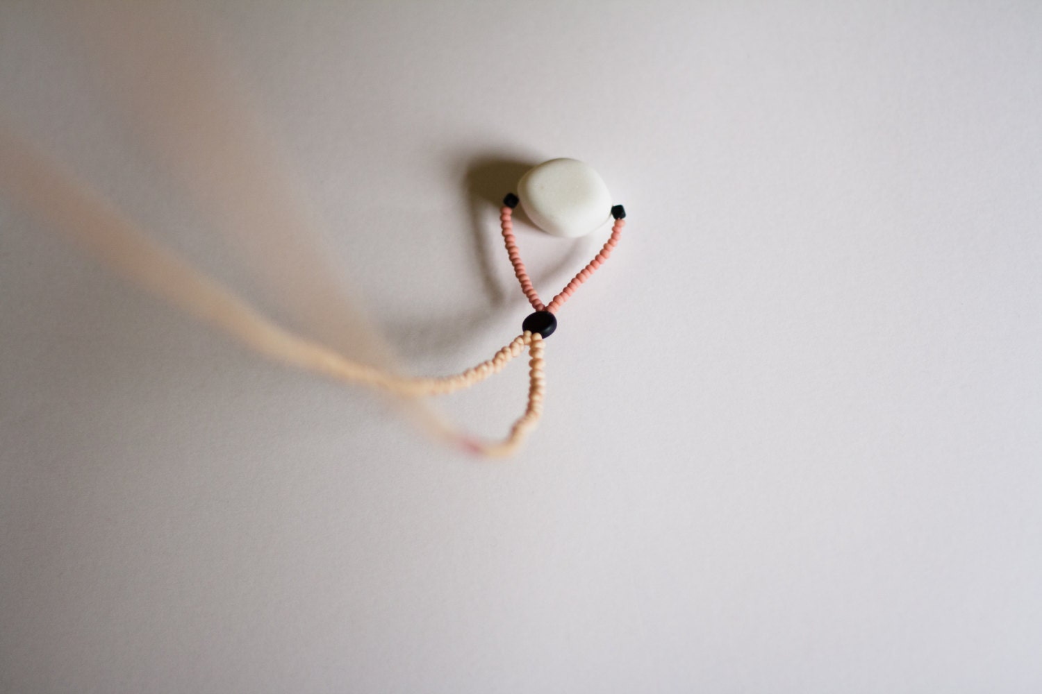 salmiak necklace (light tan) - a really long matte glass & stone pendant necklace by budpnq