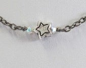 Sterling Silver Star with Sparkling Crystals on a gunmetal chain. Wear alone or layer.