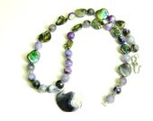 Purple bead necklace with wampum pendant