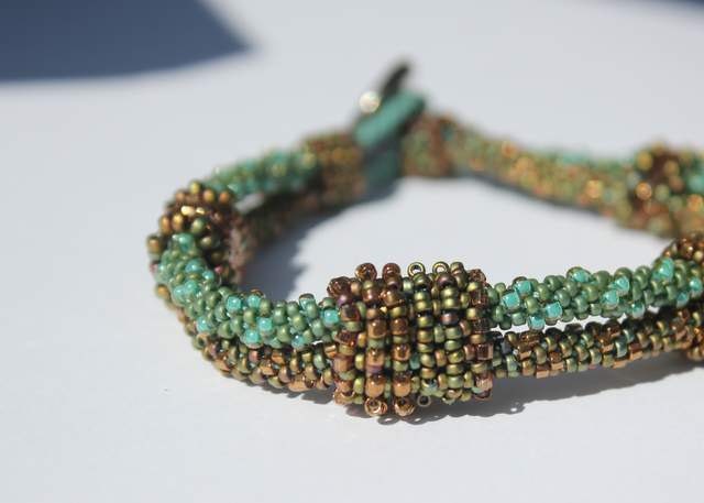 Hand Beaded Green and Bronze Kumihimo Bracelet with beaded beads and an antique Button