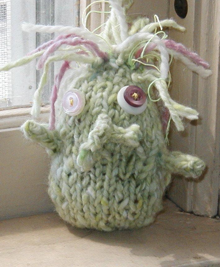 Cissy Cthuhlu gutmonster doll, handknit with crocheted guts inside and glowing hair