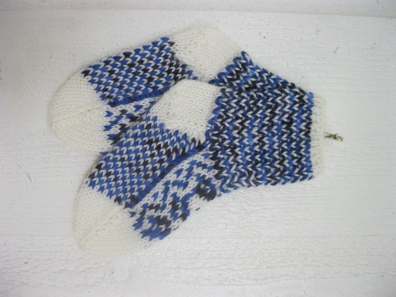 Handknitted norwegian socks in white and many shades of blue for children