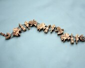 Vintage Gold Tone Music Themed Slide Bracelet Pianos and Violins