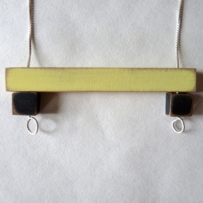 Short wooden bar necklace in butter yellow and black