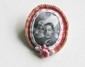 Lady in hat with rose flowers brooch