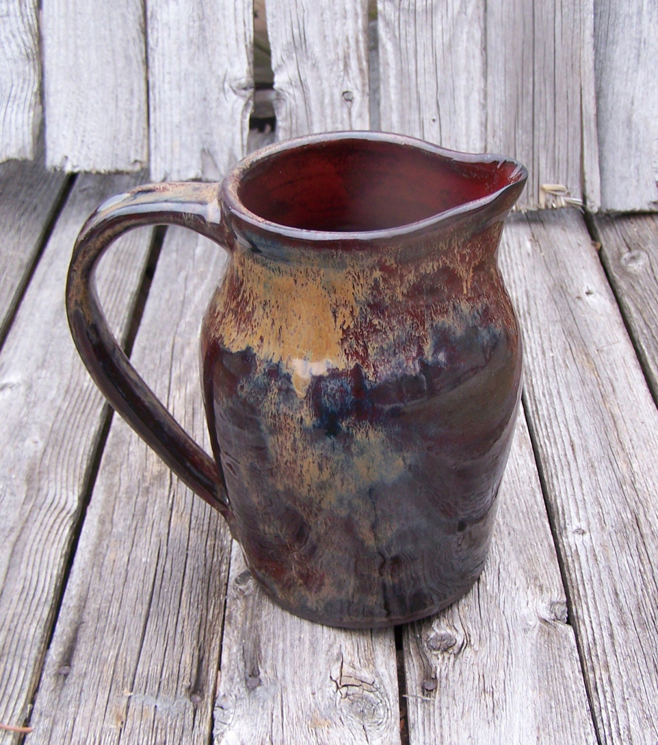 Multicolored Pitcher with Red Inside