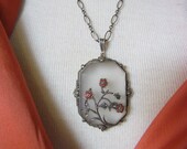 Circa 1930 Camphor Glass Pendant Necklace with Marcasite and Coral Flowers