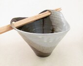 Noodle bowl with chopsticks - coffee and cream