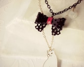 Meow necklace made with white cat charm, black ribbon, swarovski crystal heart, gold chain etc.